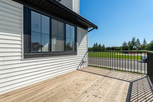 1209 Coopers Drive Sw, Airdrie, AB - Outdoor With Deck Patio Veranda With Exterior
