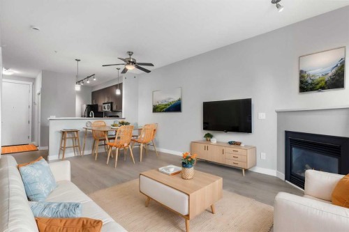 405-880 Centre Avenue Ne, Calgary, AB - Indoor Photo Showing Living Room With Fireplace