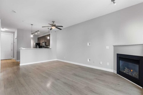 405-880 Centre Avenue Ne, Calgary, AB - Indoor Photo Showing Living Room With Fireplace