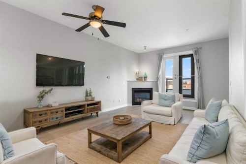 405-880 Centre Avenue Ne, Calgary, AB - Indoor Photo Showing Living Room With Fireplace