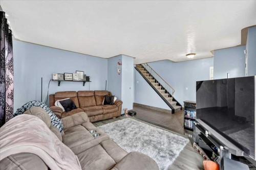 219 Penworth Drive Se, Calgary, AB - Indoor Photo Showing Living Room