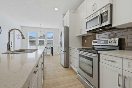 86 Marquis Common Se, Calgary, AB - Indoor Photo Showing Kitchen With Stainless Steel Kitchen With Double Sink