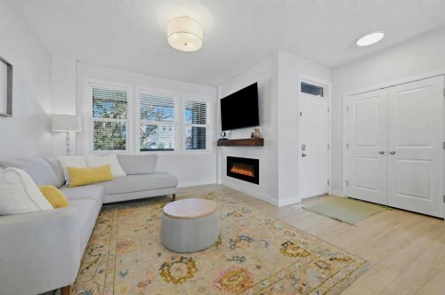 86 Marquis Common Se, Calgary, AB - Indoor Photo Showing Living Room With Fireplace