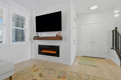 86 Marquis Common Se, Calgary, AB - Indoor Photo Showing Living Room With Fireplace