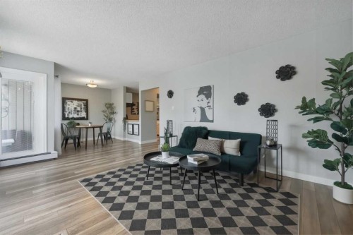 122-860 Midridge Drive Se, Calgary, AB - Indoor Photo Showing Living Room