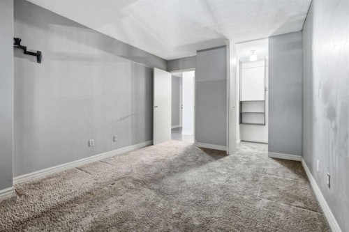 406-145 Point Drive Nw, Calgary, AB - Indoor Photo Showing Other Room