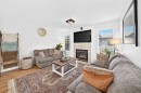286 Prestwick Circle Se, Calgary, AB  - Indoor Photo Showing Living Room With Fireplace 