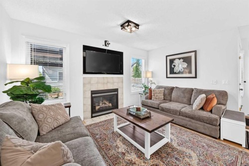 286 Prestwick Circle Se, Calgary, AB - Indoor Photo Showing Living Room With Fireplace