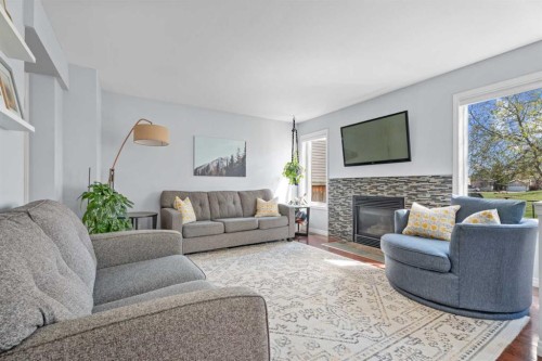 31 Mt Aberdeen Grove Se, Calgary, AB - Indoor Photo Showing Living Room With Fireplace
