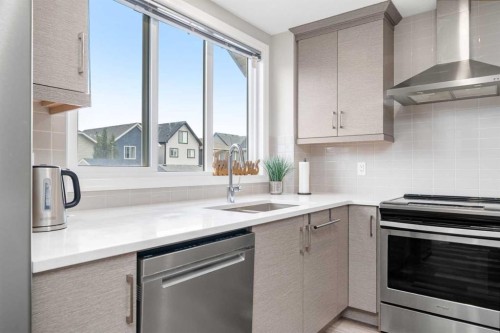 374 Magnolia Square Se, Calgary, AB - Indoor Photo Showing Kitchen With Stainless Steel Kitchen With Upgraded Kitchen