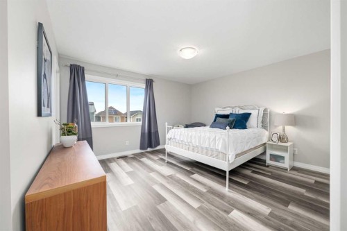 374 Magnolia Square Se, Calgary, AB - Indoor Photo Showing Bedroom