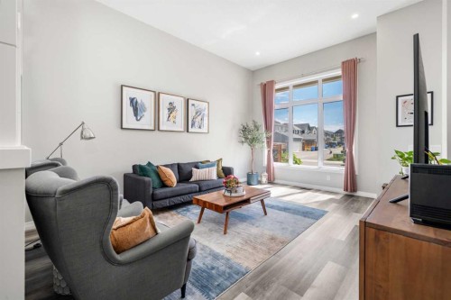 374 Magnolia Square Se, Calgary, AB - Indoor Photo Showing Living Room