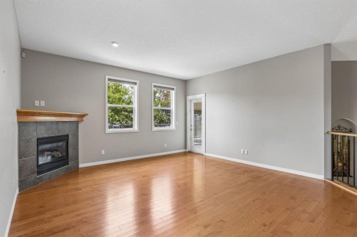 48 Rockywood Circle Nw, Calgary, AB - Indoor Photo Showing Living Room With Fireplace