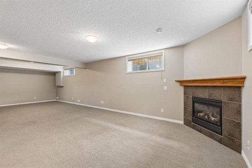 48 Rockywood Circle Nw, Calgary, AB - Indoor With Fireplace