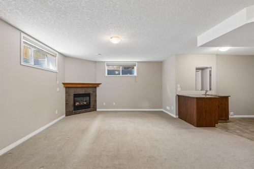 48 Rockywood Circle Nw, Calgary, AB - Indoor With Fireplace