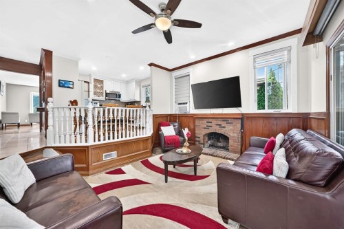 2203 65 Street Ne, Calgary, AB - Indoor Photo Showing Living Room With Fireplace