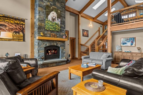 215 Benchlands Terrace, Canmore, AB - Indoor Photo Showing Living Room With Fireplace