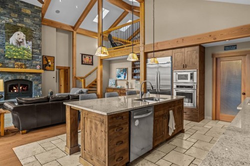 215 Benchlands Terrace, Canmore, AB - Indoor Photo Showing Kitchen With Fireplace With Double Sink