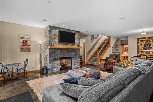 215 Benchlands Terrace, Canmore, AB - Indoor Photo Showing Living Room With Fireplace