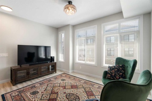 28-138 Seton Passage Se, Calgary, AB - Indoor Photo Showing Living Room