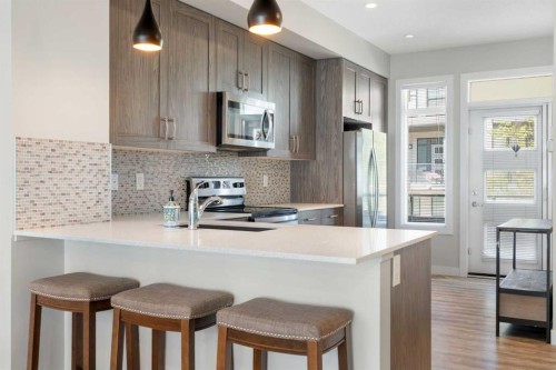 28-138 Seton Passage Se, Calgary, AB - Indoor Photo Showing Kitchen With Upgraded Kitchen