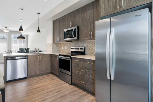 28-138 Seton Passage Se, Calgary, AB - Indoor Photo Showing Kitchen With Stainless Steel Kitchen With Upgraded Kitchen