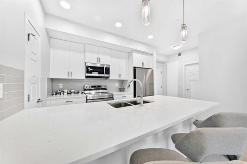 6301-20295 Seton Way Se, Calgary, AB - Indoor Photo Showing Kitchen With Stainless Steel Kitchen With Double Sink With Upgraded Kitchen