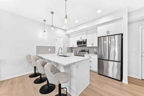 6301-20295 Seton Way Se, Calgary, AB - Indoor Photo Showing Kitchen With Stainless Steel Kitchen With Double Sink With Upgraded Kitchen