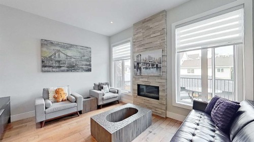 1820 37 Avenue Sw, Calgary, AB - Indoor Photo Showing Living Room With Fireplace