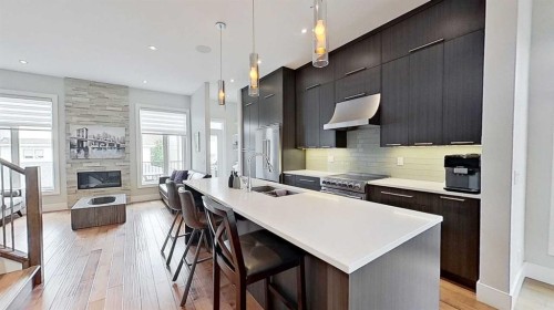 1820 37 Avenue Sw, Calgary, AB - Indoor Photo Showing Kitchen With Fireplace With Upgraded Kitchen