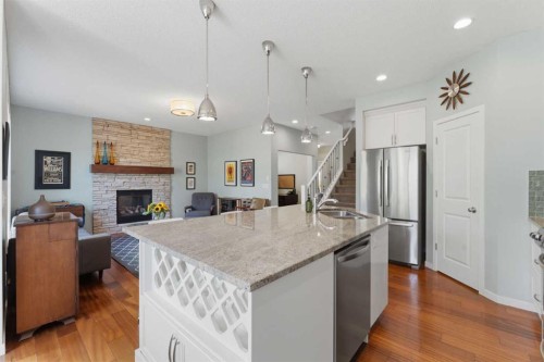 48 Brightoncrest Manor Se, Calgary, AB - Indoor Photo Showing Kitchen With Fireplace With Double Sink With Upgraded Kitchen
