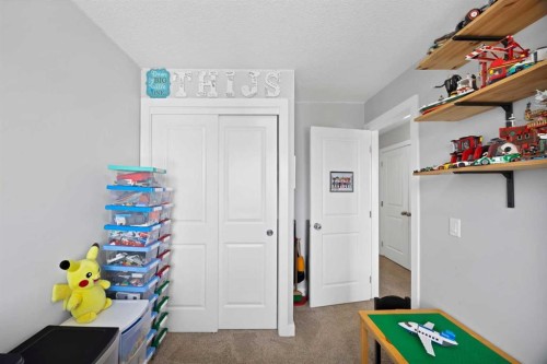 107 Jumping Pound Common, Cochrane, AB - Indoor Photo Showing Other Room