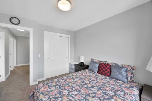 107 Jumping Pound Common, Cochrane, AB - Indoor Photo Showing Bedroom