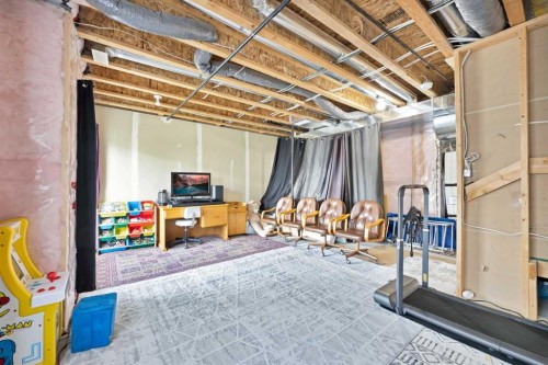 107 Jumping Pound Common, Cochrane, AB - Indoor Photo Showing Basement