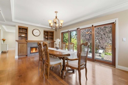 604 Willoughby Crescent Se, Calgary, AB - Indoor Photo Showing Dining Room With Fireplace