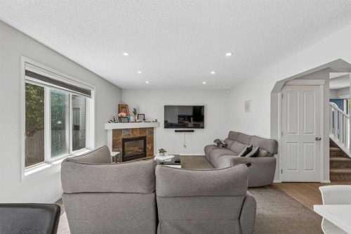 60 Cranfield Park Se, Calgary, AB - Indoor Photo Showing Living Room With Fireplace