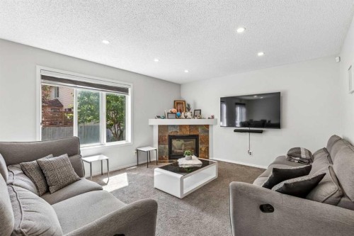 60 Cranfield Park Se, Calgary, AB - Indoor Photo Showing Living Room With Fireplace