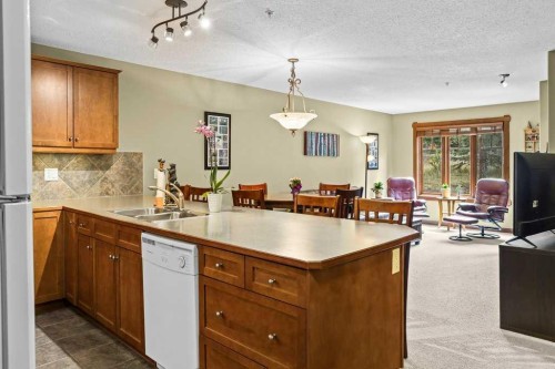 215-150 Crossbow Place, Canmore, AB - Indoor Photo Showing Kitchen With Double Sink