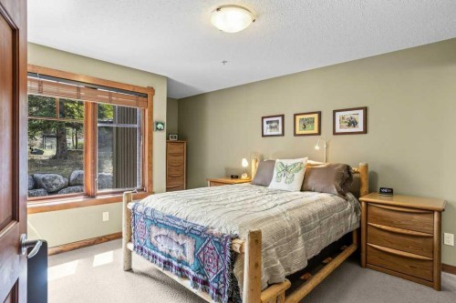 215-150 Crossbow Place, Canmore, AB - Indoor Photo Showing Bedroom