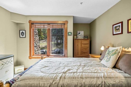 215-150 Crossbow Place, Canmore, AB - Indoor Photo Showing Bedroom