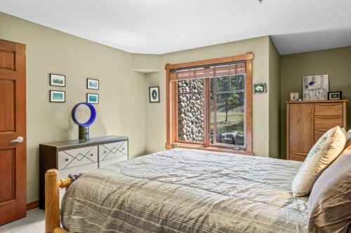 215-150 Crossbow Place, Canmore, AB - Indoor Photo Showing Bedroom