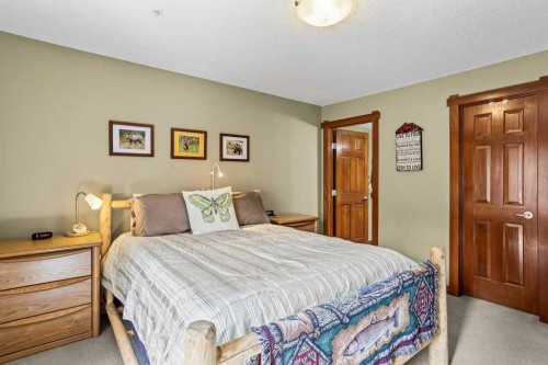 215-150 Crossbow Place, Canmore, AB - Indoor Photo Showing Bedroom
