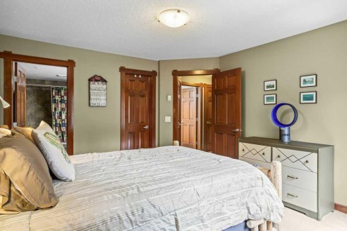 215-150 Crossbow Place, Canmore, AB - Indoor Photo Showing Bedroom