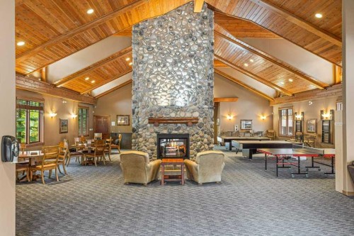 215-150 Crossbow Place, Canmore, AB - Indoor With Fireplace