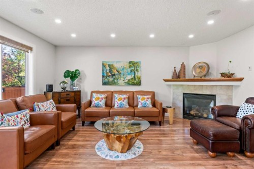 114 Chapalina Terrace Se, Calgary, AB - Indoor Photo Showing Living Room With Fireplace