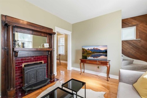 1801 2 Street Nw, Calgary, AB - Indoor Photo Showing Living Room With Fireplace
