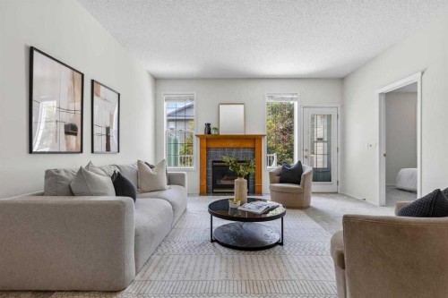 139 Hidden Valley Green Nw, Calgary, AB - Indoor Photo Showing Living Room With Fireplace