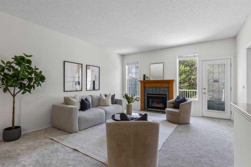 139 Hidden Valley Green Nw, Calgary, AB - Indoor Photo Showing Living Room With Fireplace