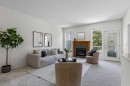139 Hidden Valley Green Nw, Calgary, AB  - Indoor Photo Showing Living Room With Fireplace 