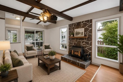 165 Spring Dale Circle Se, Airdrie, AB - Indoor Photo Showing Living Room With Fireplace